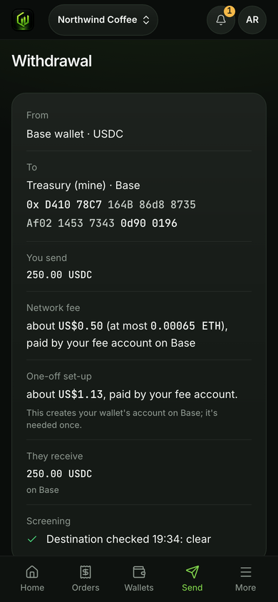 A withdrawal's Review on a phone: the network fee and the one-off set-up, each paid by the business's own fee account.